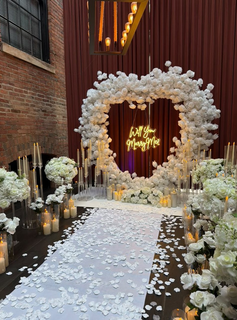 White rose 'Will You Marry Me' proposal setup