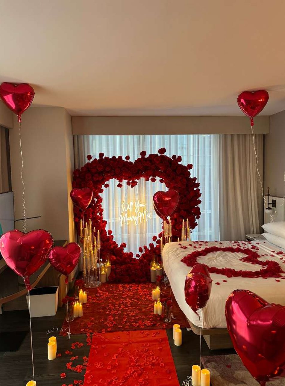 Red rose heart proposal room styling